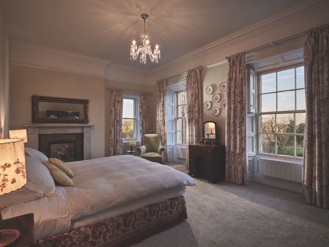 The Georgian suite at Dunmore House, with chandelier, marble fireplace and tall sash windows