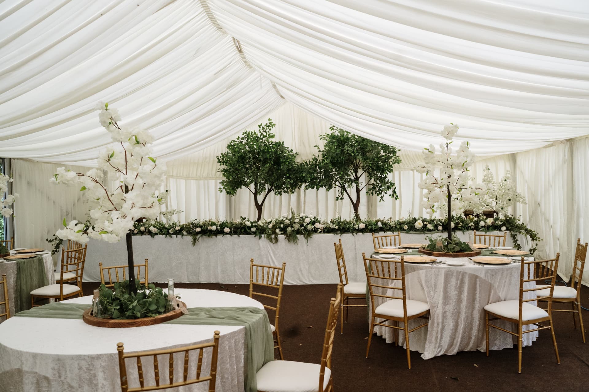 Marquee dressed for a wedding dinner at Dunmore Gardens